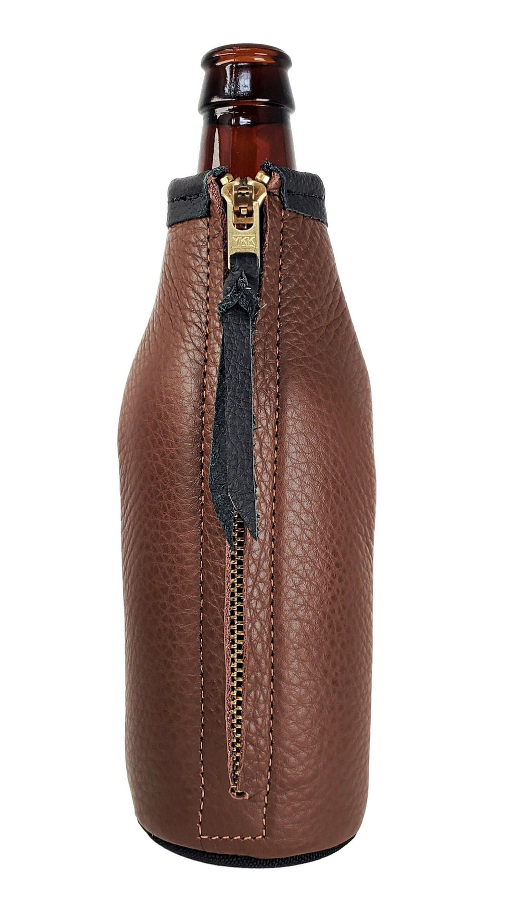 Back of a brown leather bottle holder showing the brass zipper and leather pull