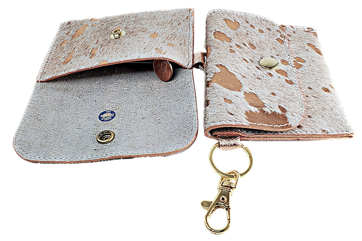 Acid-wash cowhide card wallet open to show its natural leather interior and snap closure alongside closed wallet