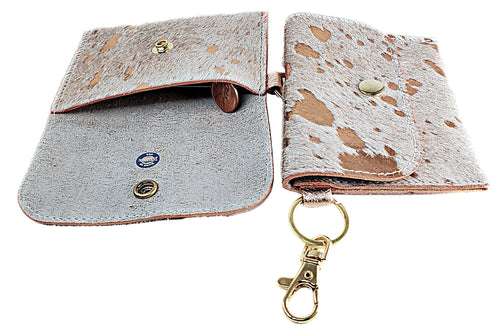 Acid-wash cowhide card wallet open to show its natural leather interior and snap closure alongside closed wallet