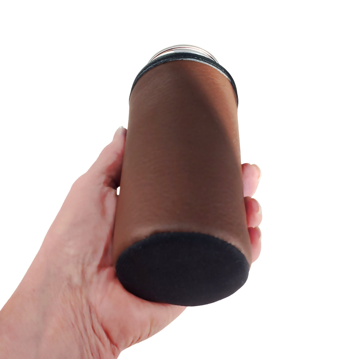 Hand holding a brown leather slim can cooler at an angle to show its reinforced bottom