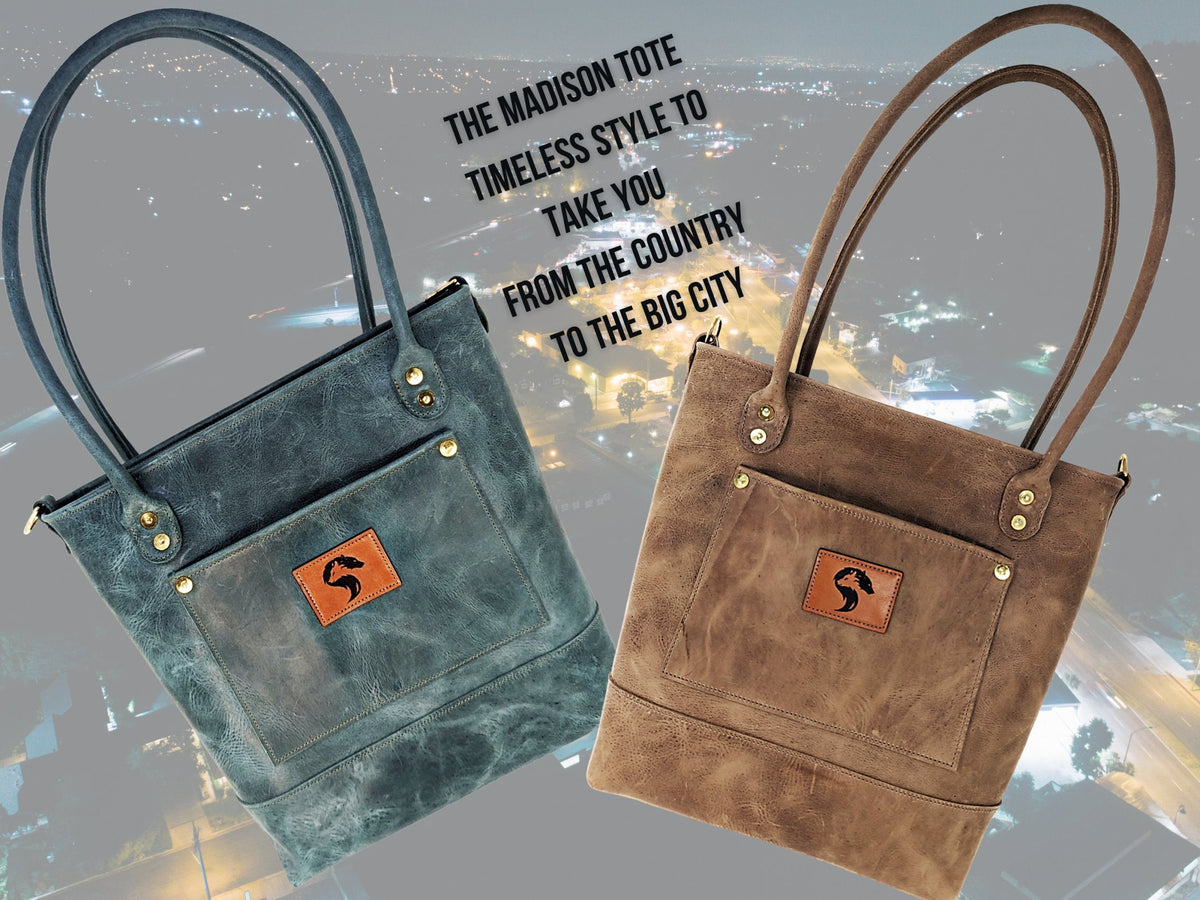 Madison distressed leather tote bags in sage and brown, pictured together against a city lights background