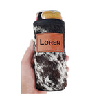 Black and white speckled cowhide slim can holder personalized with the name LOREN