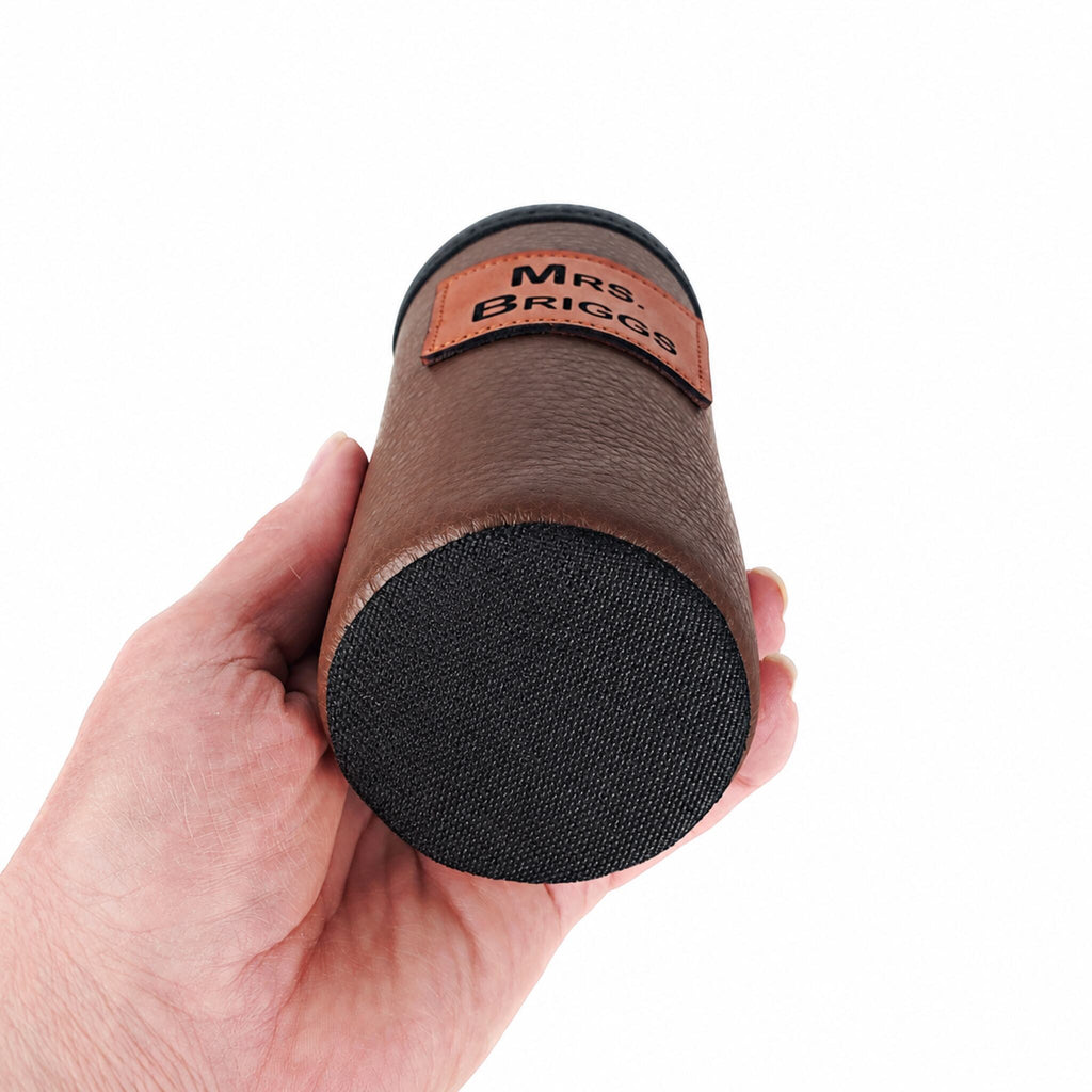 Bottom view of the brown leather slim can holder showing its black ballistic nylon base
