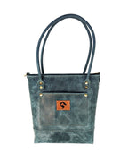 Madison distressed sage leather tote bag, front view with rolled handles, exterior pocket, and Red Sky Designs leather patch