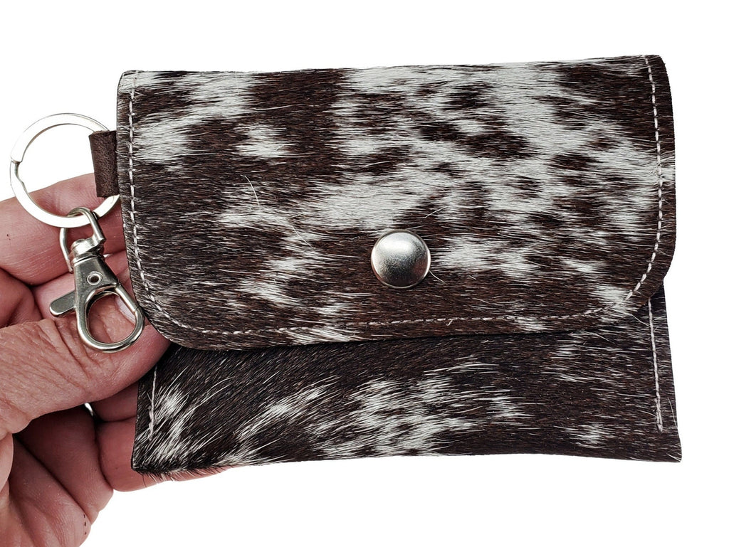 Black and white speckled hair-on cowhide mini card wallet keychain with silver snap and swivel clip