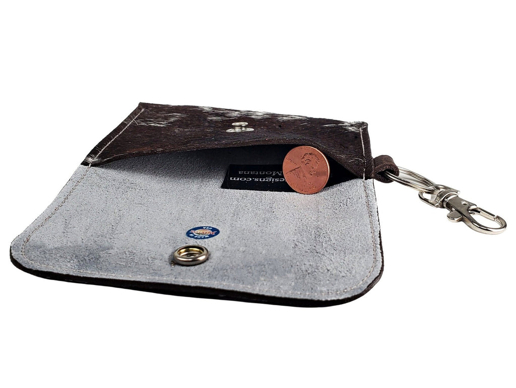 Open hair-on cowhide card wallet keychain showing the single unlined pocket, snap closure and keychain clip