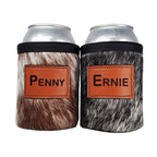 Two cowhide can holders personalized with the names PENNY and ERNIE